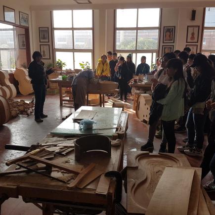 Students were visiting Musical instrument company