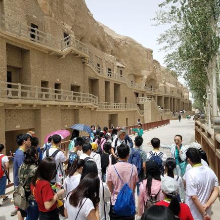 Students were visiting Mogao Grottoes